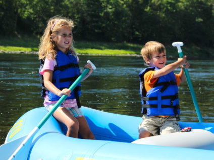 two young kids in blue raft on Delaware River Indian Head Canoeing Rafting Kayaking Tubing Delaware River