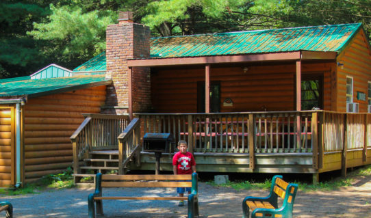 young boy standing outside cabin area Indian Head Canoeing Rafting Kayaking Tubing Delaware River