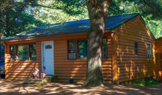 two kids sitting outside cabin Indian Head Canoeing Rafting Kayaking Tubing Delaware River