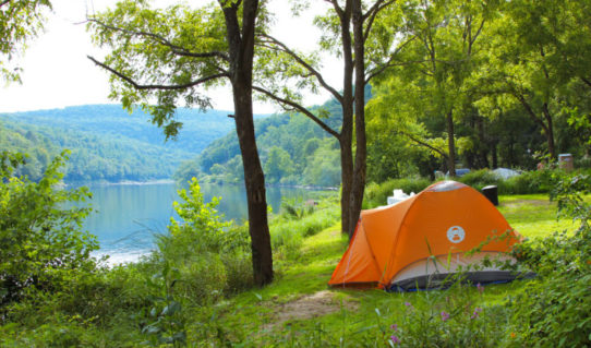 Orange tent set up along the Delaware River Indian Head Canoeing Rafting Kayaking Tubing Delaware River