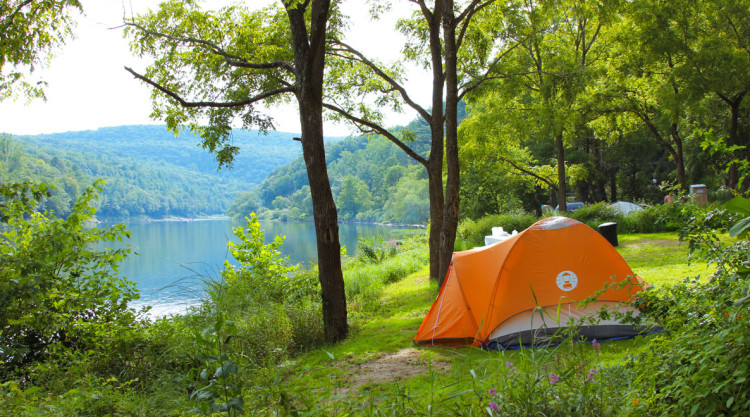 Orange tent set up along the Delaware River Indian Head Canoeing Rafting Kayaking Tubing Delaware River