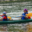 mom and daughter with bandanas racing the boys in kayak Indian Head Canoeing Rafting Kayaking Tubing Delaware River