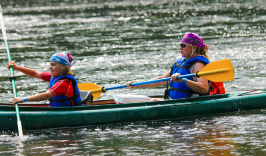 mom and daughter with bandanas racing the boys in kayak Indian Head Canoeing Rafting Kayaking Tubing Delaware River
