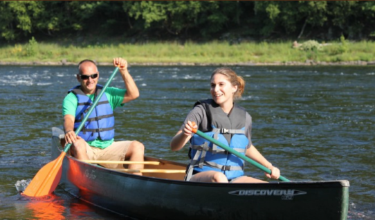 two people enjoying a sunny day on river in canoe Indian Head Canoeing Rafting Kayaking Tubing Delaware River
