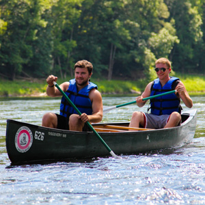 two guys in green canoe Indian Head Canoeing Rafting Kayaking Tubing Delaware River