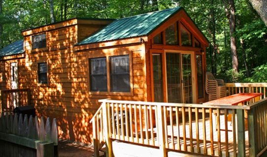 log cabin and deck on the Delaware River on a sunny day