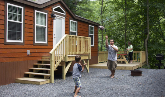 dad and son playing catch outside cabin Indian Head Canoeing Rafting Kayaking Tubing Delaware River