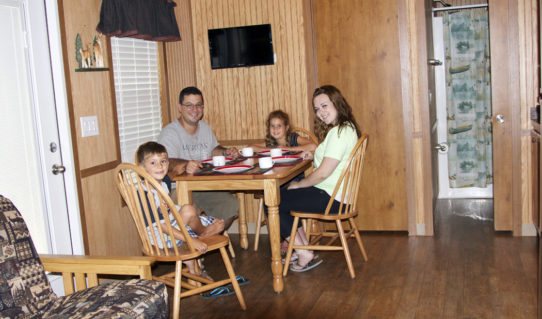 family getting ready for breakfast in deluxe cabin Indian Head Canoeing Rafting Kayaking Tubing Delaware River
