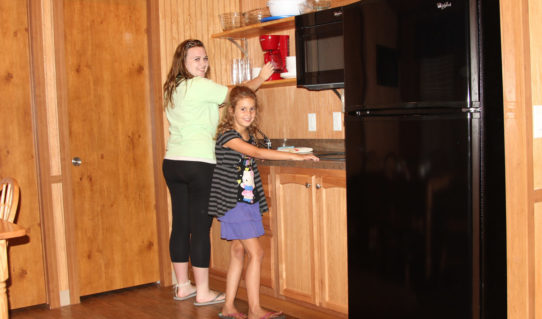 mom and daughter preparing breakfast in cabin Indian Head Canoeing Rafting Kayaking Tubing Delaware River