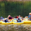 group of 9 enjoying calm waters and scenic views on river Indian Head Canoeing Rafting Kayaking Tubing Delaware River