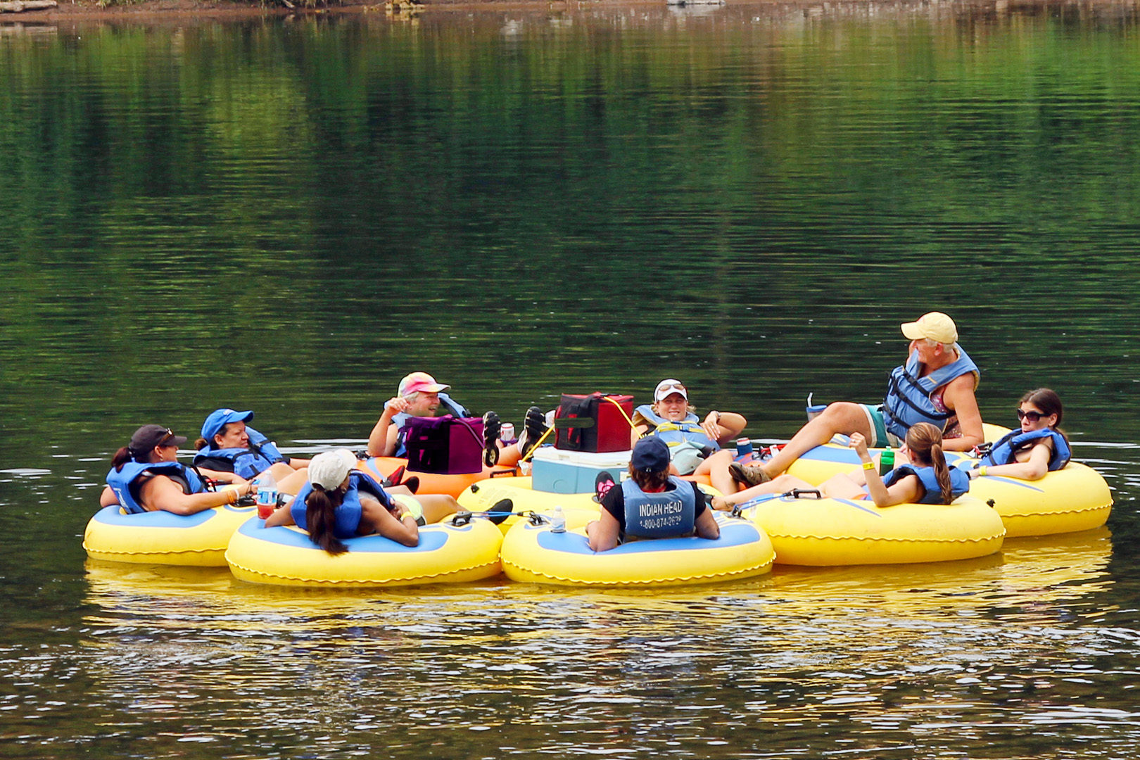 group of 9 enjoying calm waters and scenic views on river Indian Head Canoeing Rafting Kayaking Tubing Delaware River