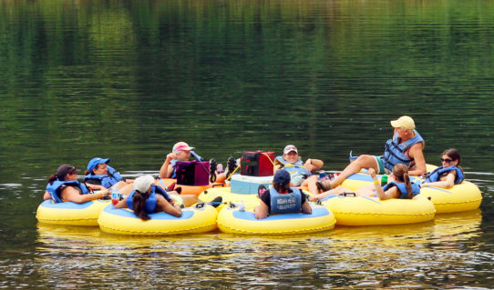 group of 9 enjoying calm waters and scenic views on river Indian Head Canoeing Rafting Kayaking Tubing Delaware River