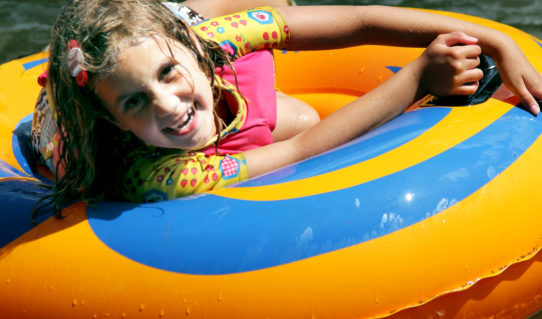 young girl enjoying her tube ride down the river Indian Head Canoeing Rafting Kayaking Tubing Delaware River
