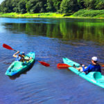 two people in their own blue kayaks in Barryville Indian Head Canoeing Rafting Kayaking Tubing Delaware River