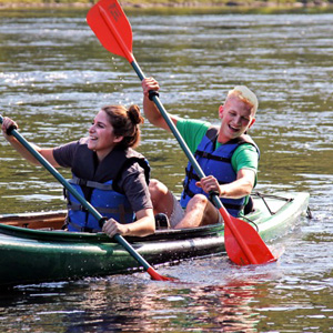 man and woman kayaking in Barryville Indian Head Canoeing Rafting Kayaking Tubing Delaware River