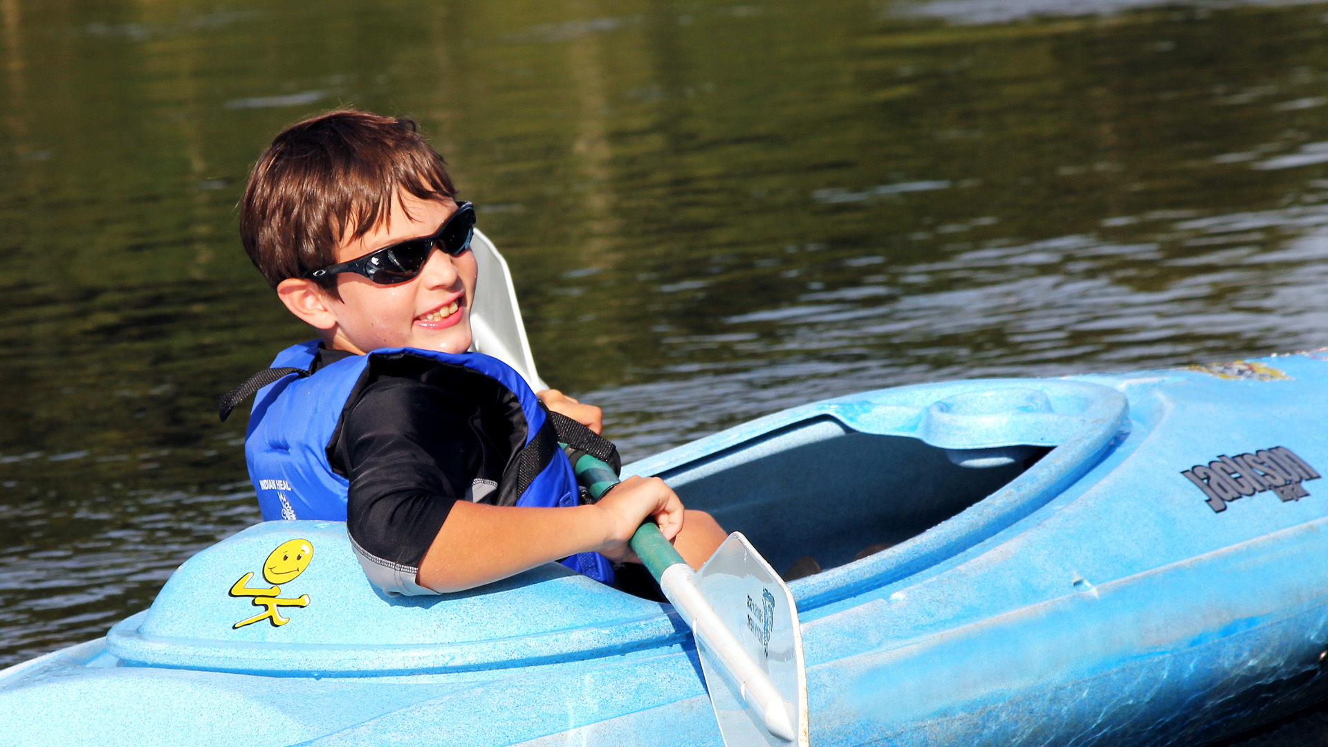 young boy floating in kayak on calm waters Indian Head Canoeing Rafting Kayaking Tubing Delaware River