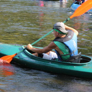 man in kayak showing his strength Indian Head Canoeing Rafting Kayaking Tubing Delaware River