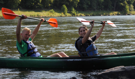 two people in kayak holding up paddles as they finish their tour Indian Head Canoeing Rafting Kayaking Tubing Delaware River