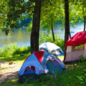 camping tents set up along river with rafters in distance Indian Head Canoeing Rafting Kayaking Tubing Delaware River