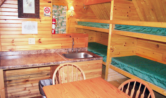 inside cabin with bunk beds and kitchenette Indian Head Canoeing Rafting Kayaking Tubing Delaware River