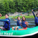 kids in raft celebrate after arriving to shore Indian Head Canoeing Rafting Kayaking Tubing Delaware River