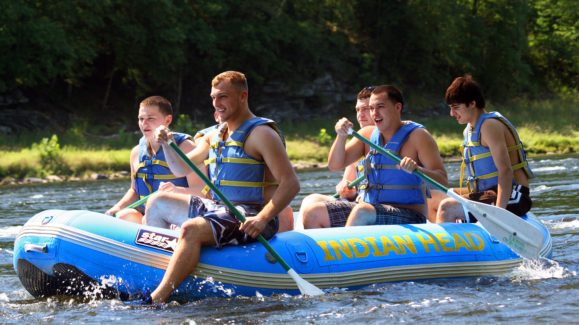 group of guy friends in raft on calm waters Indian Head Canoeing Rafting Kayaking Tubing Delaware River