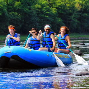 four friends in raft enjoying Indian Head Canoeing Rafting Kayaking Tubing Delaware River