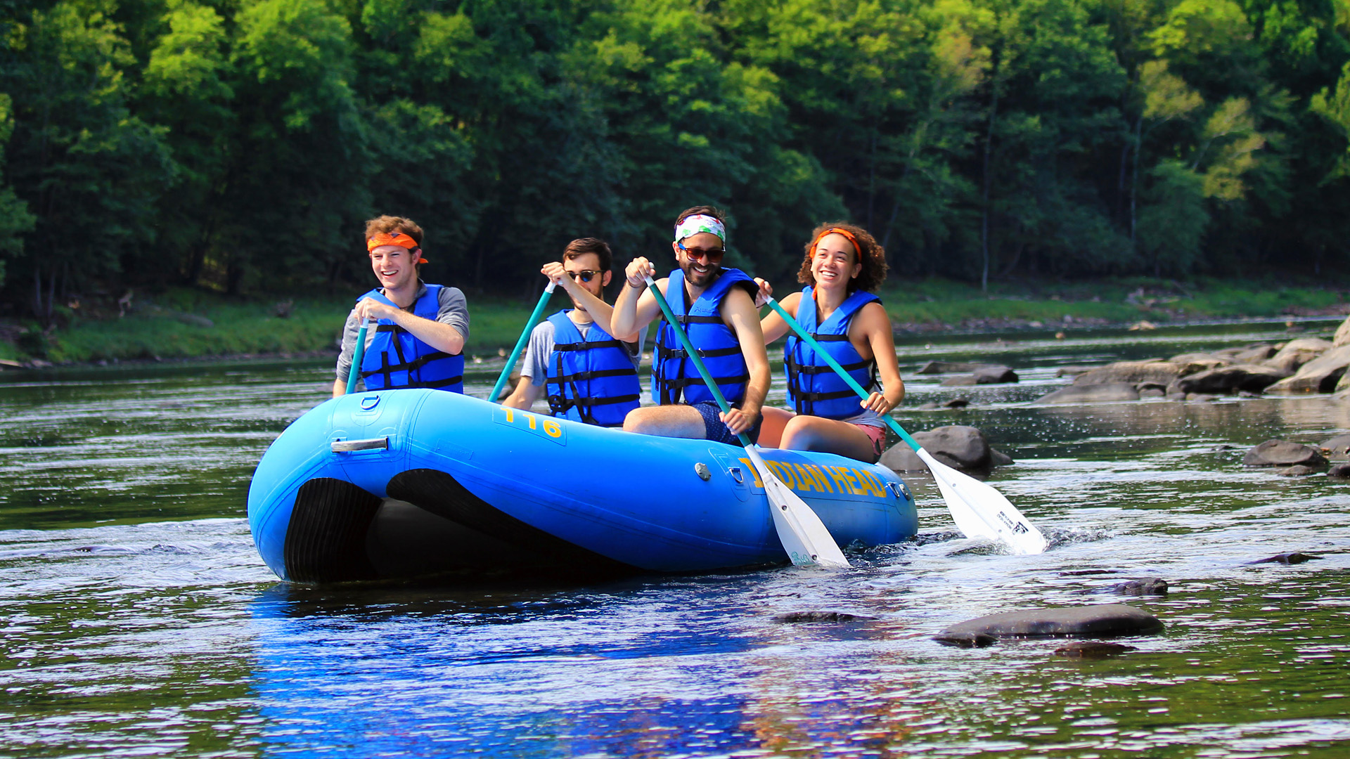 four friends in raft enjoying Indian Head Canoeing Rafting Kayaking Tubing Delaware River