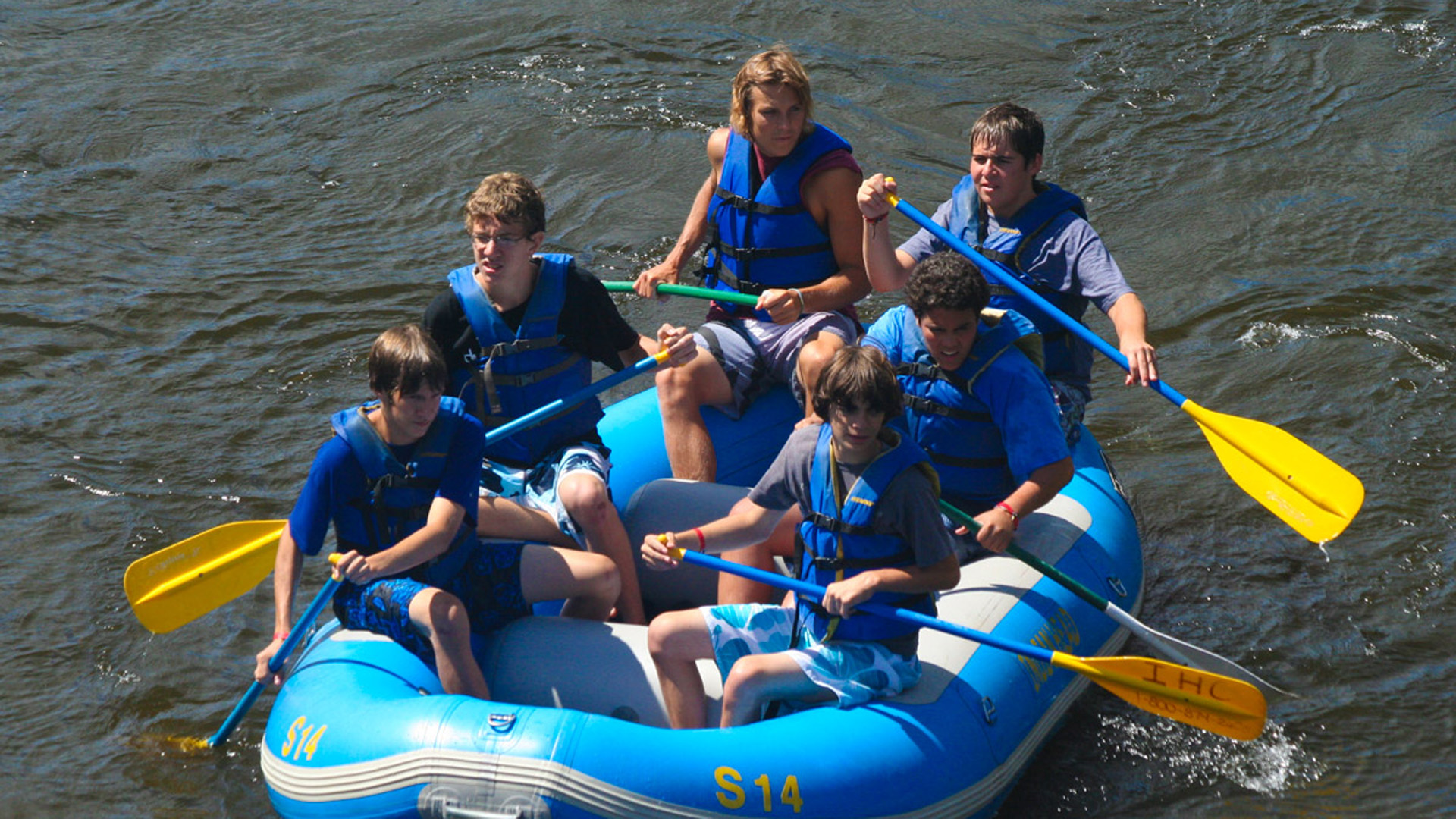 group of guys rafting on the whitewater Indian Head Canoeing Rafting Kayaking Tubing Delaware River