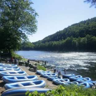 rafts staged on shore before guests arrive Indian Head Canoeing Rafting Kayaking Tubing Delaware River