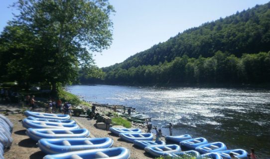 rafts staged on shore before guests arrive Indian Head Canoeing Rafting Kayaking Tubing Delaware River