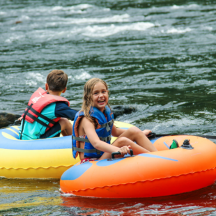 young girl having fun in a tube on the river Indian Head Canoeing Rafting Kayaking Tubing Delaware River