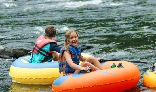 young girl having fun in a tube on the river Indian Head Canoeing Rafting Kayaking Tubing Delaware River