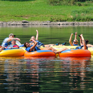 small group enjoying calm waters and scenic views on river Indian Head Canoeing Rafting Kayaking Tubing Delaware River