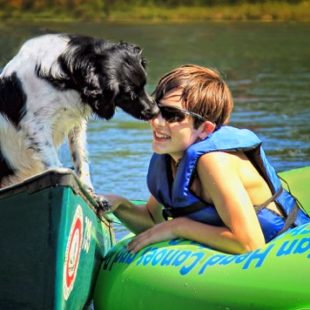 dog and teen boy enjoying a canoe and tube ride Indian Head Canoeing Rafting Kayaking Tubing Delaware River