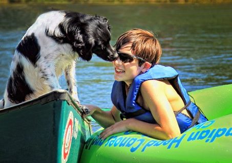 dog and teen boy enjoying a canoe and tube ride Indian Head Canoeing Rafting Kayaking Tubing Delaware River