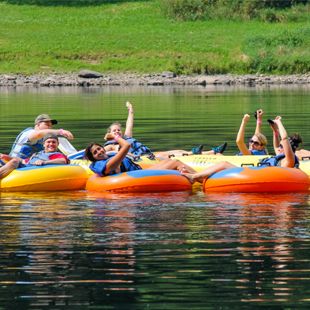 Group of friends enjoying tubing on Delaware River Indian Head Canoeing Rafting Kayaking Tubing Delaware River